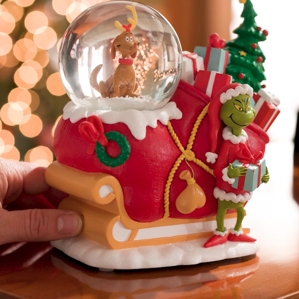 A snow globe featuring Max and The Grinch, from Dr. Seuss's 